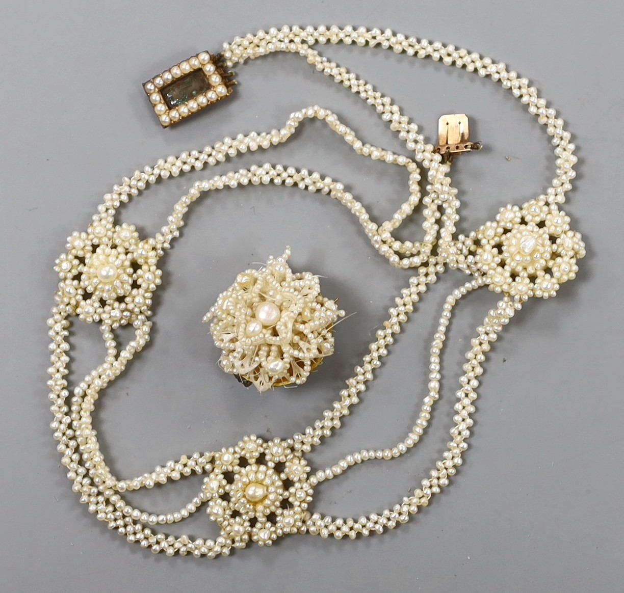 A 19th century seed pearl cluster set necklace, with yellow metal clasp, 32cm and a similar brooch.